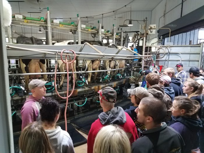 Dairy management students touring a dairy operation
