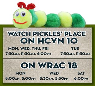 Yelllow and Green caterpiller on a box with tv channels and times to watch Pickels' place