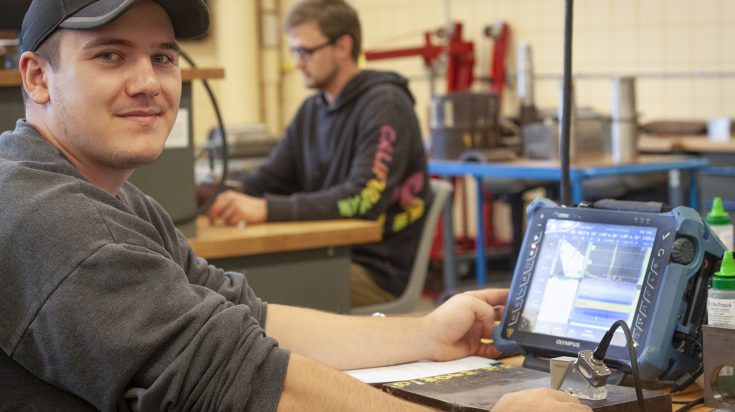 Nondestructive Testing student checking metal