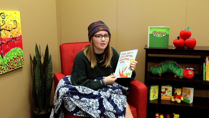 Photo of Jerika Ziermann reading a book