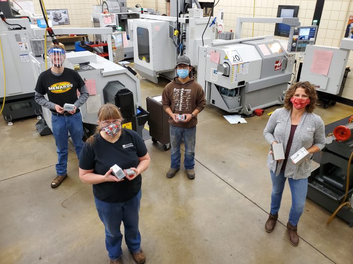Ridgewater students and instructor standing in machine tool 