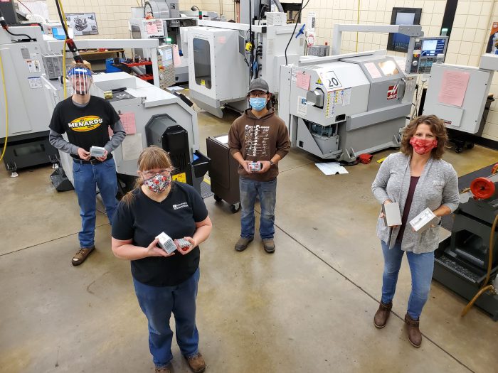 Ridgewater students and instructor standing in machine tool