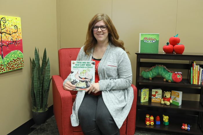 Photo of Early Education Student Laci McCann prepares to read